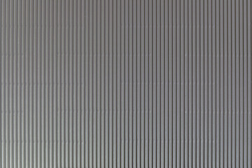 Obraz premium The texture of corrugated cardboard craft paper - grey. Grey corrugated cardboard useful as a background and texture.
