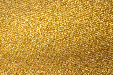 The texture of corrugated cardboard craft paper - gold. Gold corrugated cardboard useful as a...