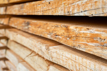 A stack of rough-cut wooden planks set up to dry, Bavaria, Germany.