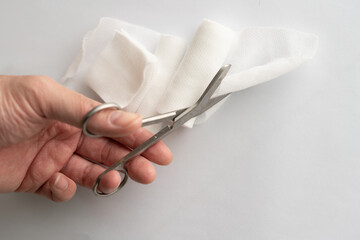 Dressing or clean wound tools includes Roll gauze,pile of gauzes and gauze roll cutter or scissors...