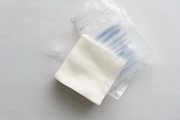 plastic tears individually wrapped gauze on a white background