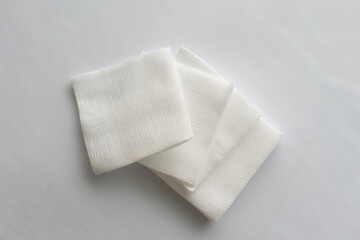 white gauze pads on white background
