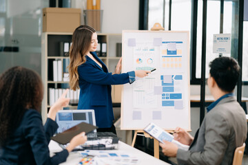 Office colleagues have a casual discussion. During a meeting in a conference room, a group of business teem new startup project