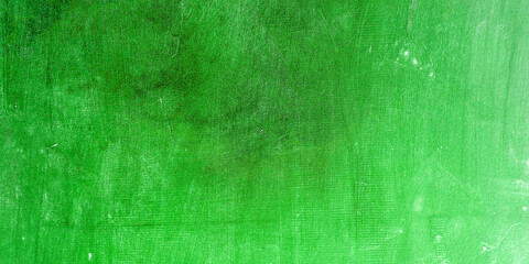 green background, Uneven concrete wall painted in different colors as a background