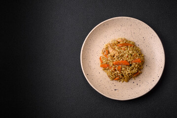 Delicious Uzbek pilaf with chicken, carrots, barberry, spices and herbs