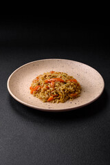 Delicious Uzbek pilaf with chicken, carrots, barberry, spices and herbs