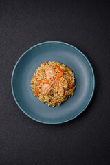 Delicious Uzbek pilaf with chicken, carrots, barberry, spices and herbs
