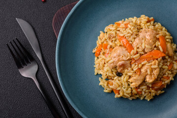 Delicious Uzbek pilaf with chicken, carrots, barberry, spices and herbs