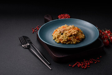 Delicious Uzbek pilaf with chicken, carrots, barberry, spices and herbs