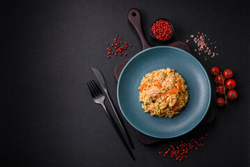 Delicious Uzbek pilaf with chicken, carrots, barberry, spices and herbs