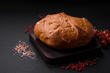 Delicious fresh crispy brown bread with seeds and grains