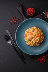 Delicious Uzbek pilaf with chicken, carrots, barberry, spices and herbs