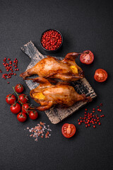 Roasted quail, partridge or pigeon stuffed with orange with spices and herbs