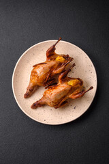 Roasted quail, partridge or pigeon stuffed with orange with spices and herbs