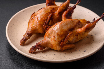 Roasted quail, partridge or pigeon stuffed with orange with spices and herbs