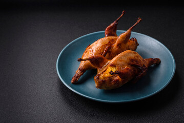 Roasted quail, partridge or pigeon stuffed with orange with spices and herbs