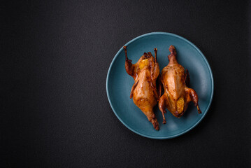 Roasted quail, partridge or pigeon stuffed with orange with spices and herbs
