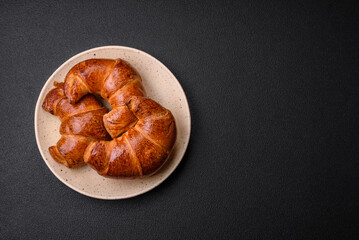 Delicious baked crispy croissants as an element of an invigorating, nutritious breakfast