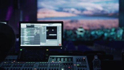 Backstage control room. Control panel with computer screen displaying data