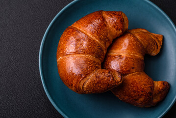 Delicious baked crispy croissants as an element of an invigorating, nutritious breakfast