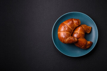 Delicious baked crispy croissants as an element of an invigorating, nutritious breakfast