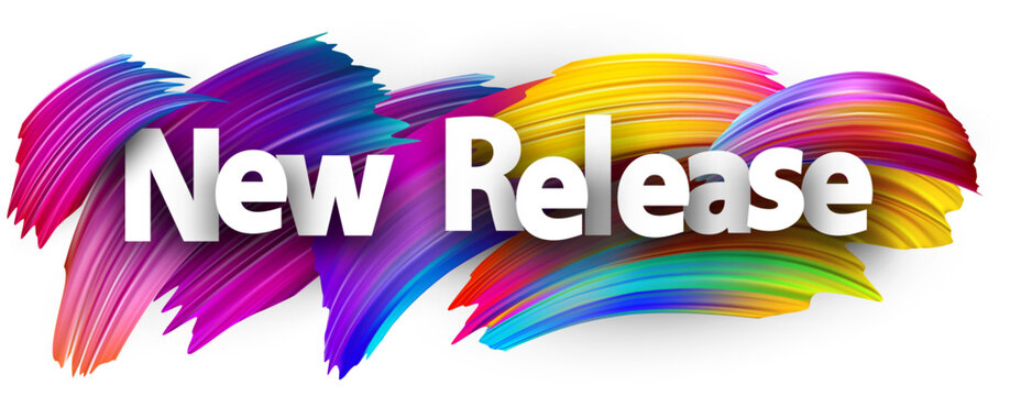 New release paper word sign with colorful spectrum paint brush strokes over white.