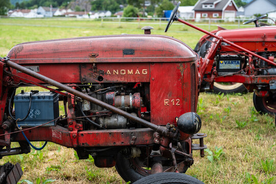Lyngdal, Norway - June 27 2023: Vintage red Hanomag R12 tractor in a field.