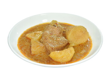 pork curry with slice potato and pineapple or mussaman on plate