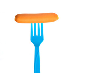 Sausage on fork isolated on white background