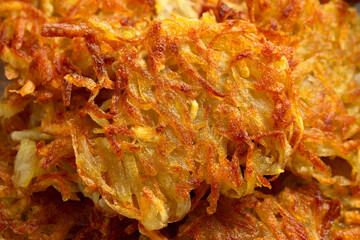 Potato rosti or hash brown close up, background