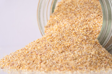 Granulated Air Dried Shallots Spilled from a Jar