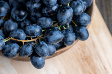 Unwashed blue grapes in the dust