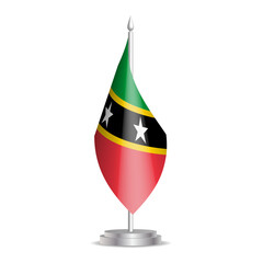 Obraz premium Saint Kitts and Nevis flag - 3D mini flag hanging on desktop flagpole. Usable for summit or conference presentaiton. Vector illustration with shading.