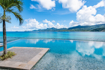 Infinity pool with sea view on tropical Island.