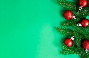 Obraz na płótnie Canvas christmas card with fir branches and Christmas toys
