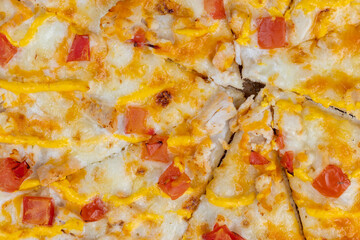 homemade cold pizza with sauce and tomatoes