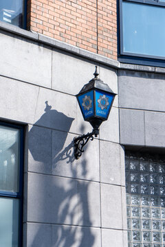 Lantern with logo and Garda lettering on the house facade from the Store Street Garda Station in
Dublin, Ireland 