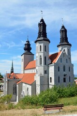 Picturesque view of Visby, Gotland, Sweden with a crystal clear blue sky and a classic church