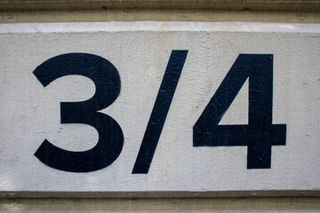 Black three quarters numbers on the exterior wall