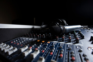 Microphone with audio mixer in the control room audio system.