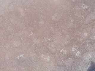 Texture of pink brine. Natural salt. Sea brine background. 