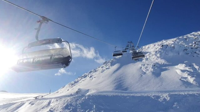 Skiing on Winter ski resort in the Austrian Alps. Hintertuxer glacier. Winter scenery of sun, snow and skiers.