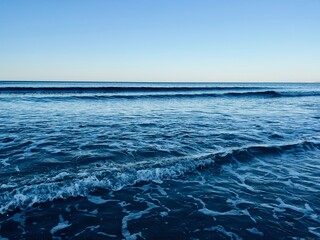 Evening blue seascape, sea horizon, seashore background 