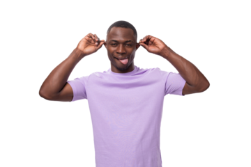 young cheerful african man with a short haircut dressed in a lilac t-shirt makes a grimace