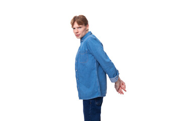 young redhead man in a stylish blue shirt on a white background with copy space