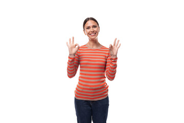Obraz premium a pretty young adult woman with black hair dressed in an orange sweater is actively gesturing on a white background with copy space