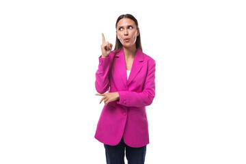 young business assistant woman with black flowing hair wears a bright crimson jacket to work