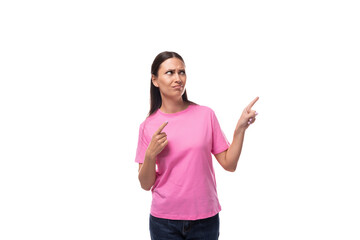 young stylish woman with straight black hair is wearing a pink t-shirt with mockup