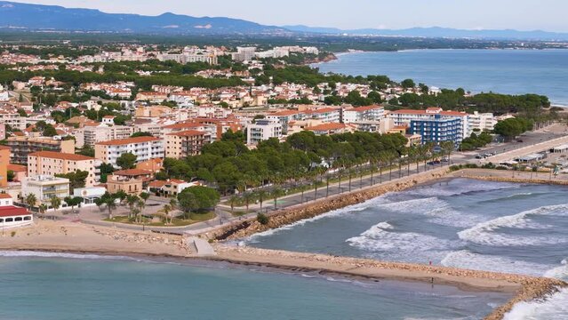 Aerial drone view of the coastal town in Spain named L'Hospitalet de l'infant