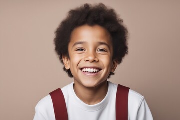 portrait of an attractive african american boy smiling against a grey background portrait of an attractive african american boy smiling against a grey background african - american little kid with cur - obrazy, fototapety, plakaty